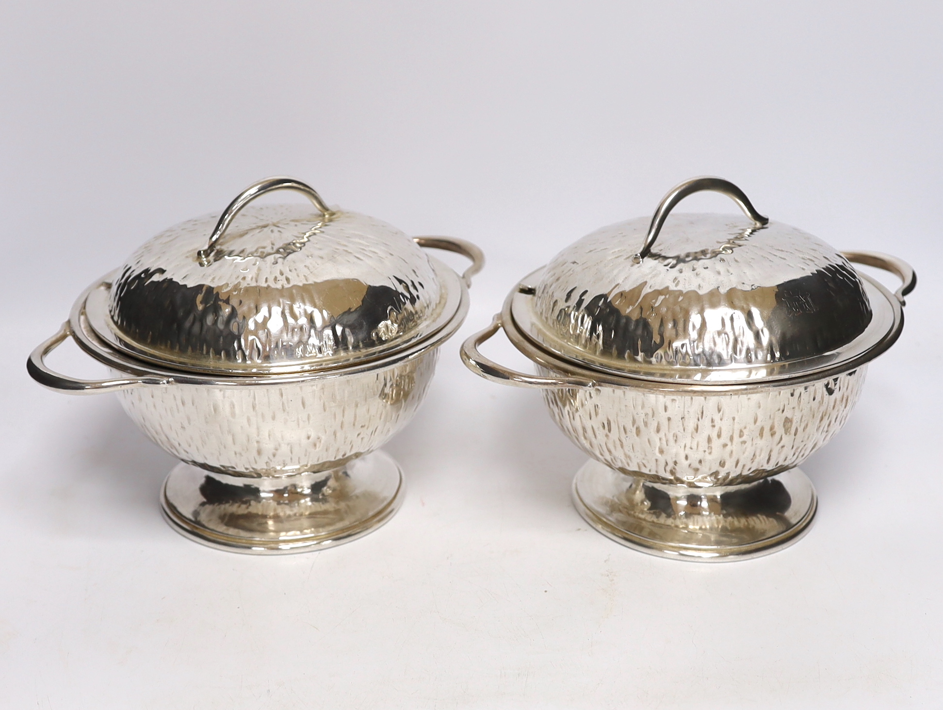 A pair of Hukin & Heath plated tureens and covers, attributed to Christopher Dresser, stamp to the bases, 27cm wide